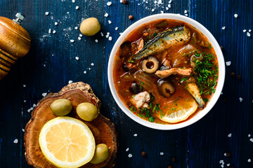 Solyanka, Russian soup with fish, olives and sour cream