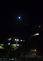 Downtown City Block lights Up In Moonlight
