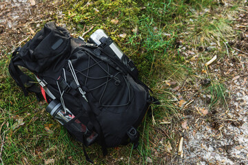 Traveler's backpack with supplies on the ground