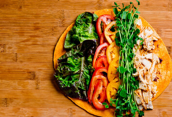 Grilled vegetable sandwich. Peppers, onions and basil served on toasted bread, cheese, pesto mayonnaise and seasoned salt and pepper. Classic American restaurant lunch or brunch sandwich favorite.