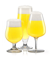 Set of fresh light beer glasses with bubble froth isolated on white background.