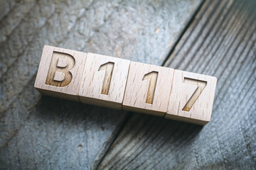 B117 SARS-CoV-2 Mutation Written On Wooden Blocks On A Board