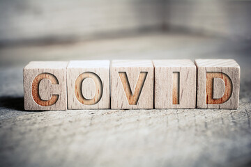 Covid Written On Wooden Blocks On A Board