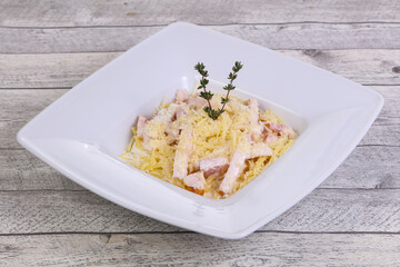 Pasta carbonara with ham and cheese