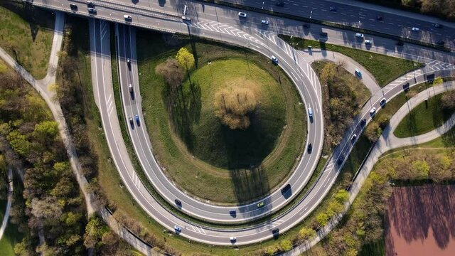 Aerial of traffic during rush hour, motorway in Munich Germany Europe in 4k, intersection with lots of cars in urban area, drone