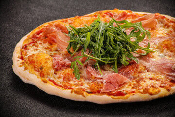 Pizza with parma and rucola