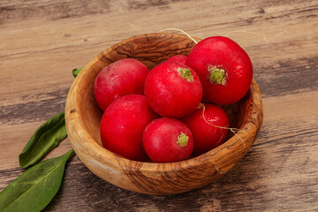 Ripe fresh radish heap over wooden