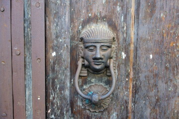 Door knocker with eyes open