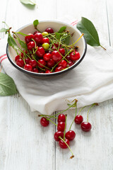 Summer cherry in enamel bowl for pie, homemade dessert