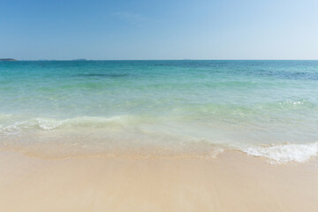 Fototapeta na wymiar Beach and waves tropical sea with blue sky on sunny day background. copy space..