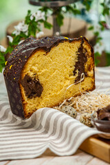 Panettone is the traditional Italian dessert for easter in 2021. Homemade panettone covered in chocolate and sprinkles. Bread served as dessert.