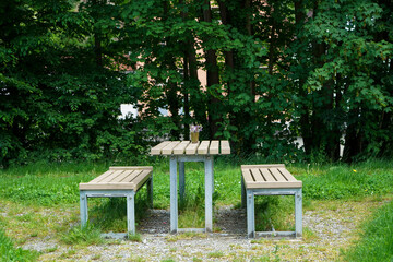 Benches and chairs at tables invite you to relax and unwind