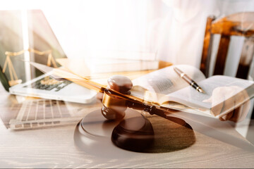 Business and lawyers discussing contract papers with brass scale on desk in office. Law, legal services, advice, justice and law concept picture with film grain effect