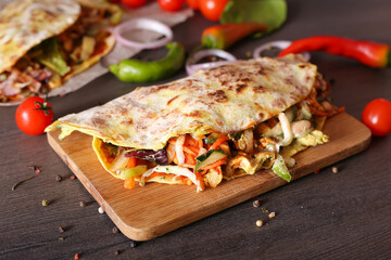 Mexican tacos on a wooden surface