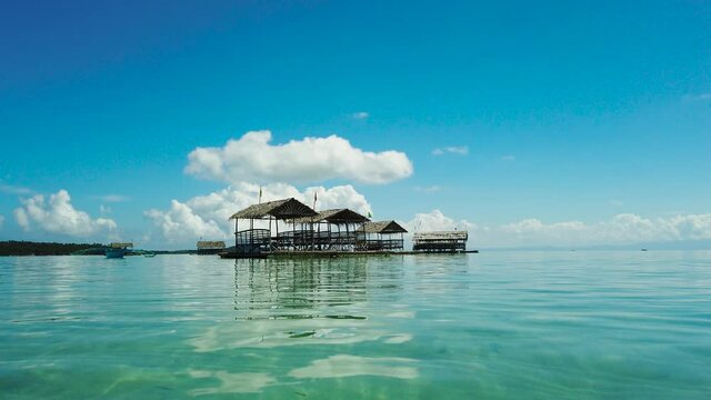 Manlawi Sandbar floating cottages in Caramoan Islands. Summer and travel vacation concept.