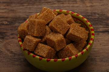 Cane sugar cubs in the bowl