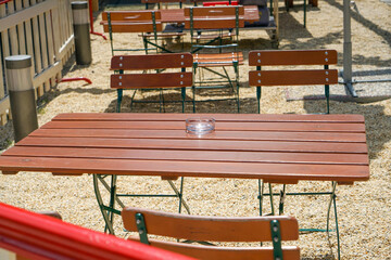 Benches and chairs at tables invite you to relax and unwind