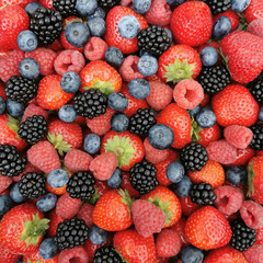 Berries background - strawberries, blueberries, raspberries and blackberries. Healthy food, summer food, vitamins concept. Top view.