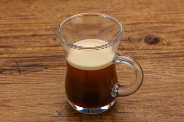 Hot Espresso coffee over wooden table