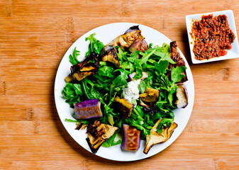 Eggplant salad. Classic American salad with iceberg lettuce, blue cheese dressing, red onions, bacon, Parmesan cheese, olive oil, lemon juice, salt and pepper. A Fine dining restaurant classic.
