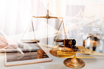 Business and lawyers discussing contract papers with brass scale on desk in office. Law, legal services, advice, justice and law concept picture with film grain effect