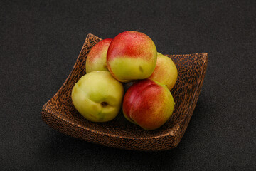 Sweet small nectarines in the basket