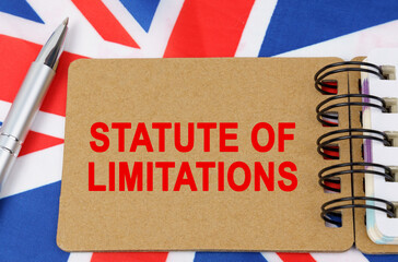 Against the background of the flag of Great Britain lies a notebook with the inscription - STATUTE OF LIMITATIONS