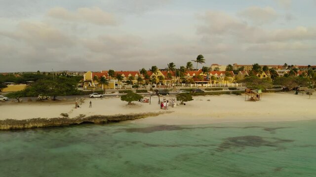aerial drone image of a wedding at eagle beach at sunset in aruba caribbean