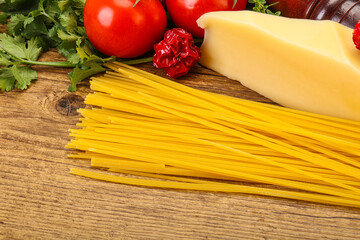 Raw Italian spaghetti heap with cheese