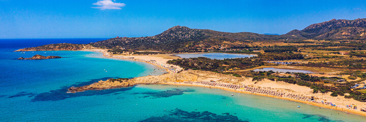 Panorama of the wonderful beaches of Chia, Sardinia, Italy. View of beautiful Chia bay and wonderful beaches, Sardinia island, Italy. Beautiful sea and bay on Su Guideu beach, Sardinia island, Italy