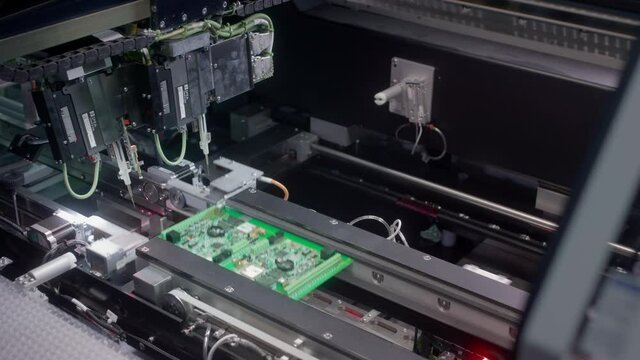 The fourth industrial revolution. Electronic circuit board production. Automated Circut Board machine Produces Printed digital electronic board. Electronics contract manufacturing. High-tech