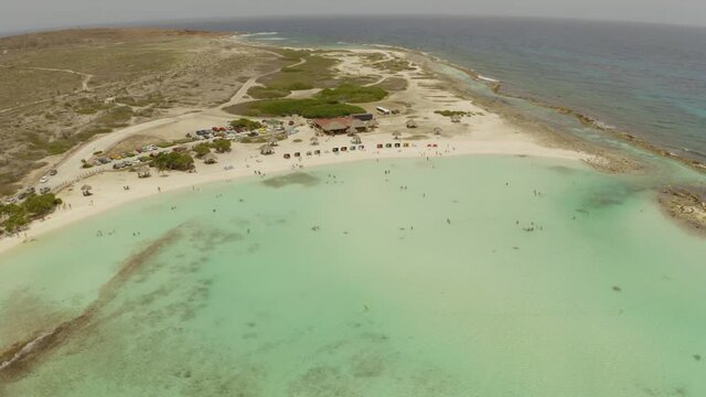 aerial image with drone of the baby beach in aruba in the caribbean