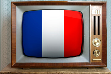 old tube vintage TV with the national flag of France on the screen, the concept of eternal values...