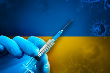 Ukraine Covid-19 Vaccination Campaign. Hand in a blue rubber glove holds a syringe with covid-19...