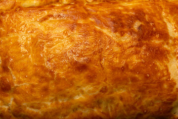 Obraz na płótnie Canvas Fried dough texture background. Fried pie close-up.