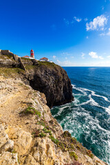 Fototapeta na wymiar Portuguese coast, cliff into the Atlantic Ocean. Taken in Sagres, Faro, Algarve, Portugal. Beautiful coast of Portugal, Sagres.