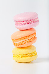 Colorful cake macaroons on a light background