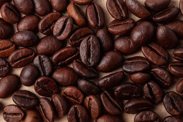 Roasted coffee beans like a background for wallpaper or decor
