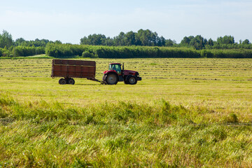 Fototapeta premium Tractor in the field for agricultural work. 