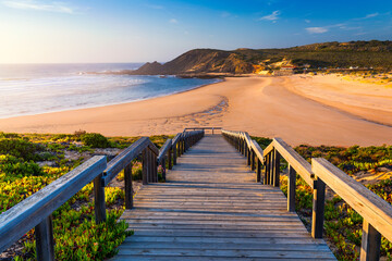 Wooden walkway to the beach Praia da Amoreira, District Aljezur, Algarve Portugal. Panorama from...