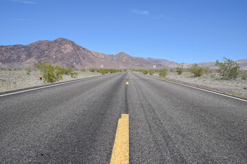 Fototapeta na wymiar A desert highway road through Death Valley
