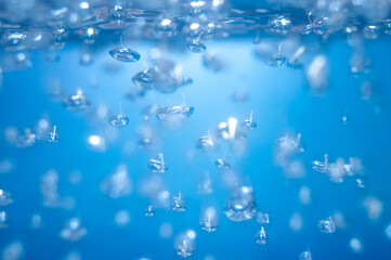 air bubbles in the water isolated on blue background