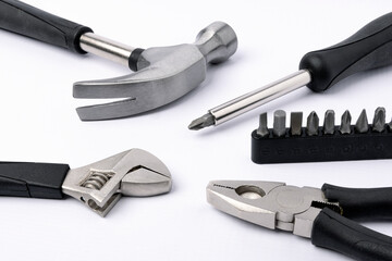 Set of metal working tools on white background.