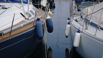 bumper buoys from sailboats at harbor © Esteve