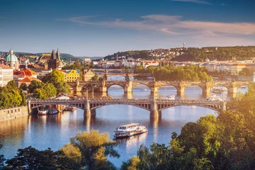 Fotobehang Prague Scenic spring sunset aerial view of the Old Town pier architecture and Charles Bridge over Vltava river in Prague, Czech Republic © daliu