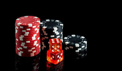 Dice with a winning combination in poker and chips on a black table. The idea of a poker game. Free advertising space