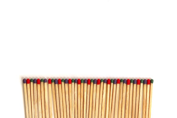 A row of multicolored matches isolated on a white background