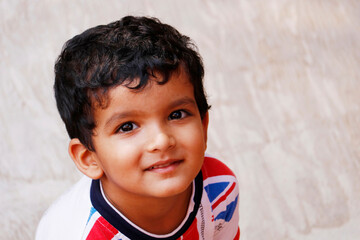 three year age indian baby boy in close up with background