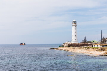 Fototapeta premium Rocky coast of the Tarkhankut peninsula - the westernmost part of Crimea. The white lighthouse