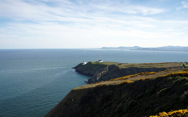 Fototapeta na wymiar Walk along the shores of the Irish Sea, Howth Peninsula, View of Baily Lighthouse.Ireland.